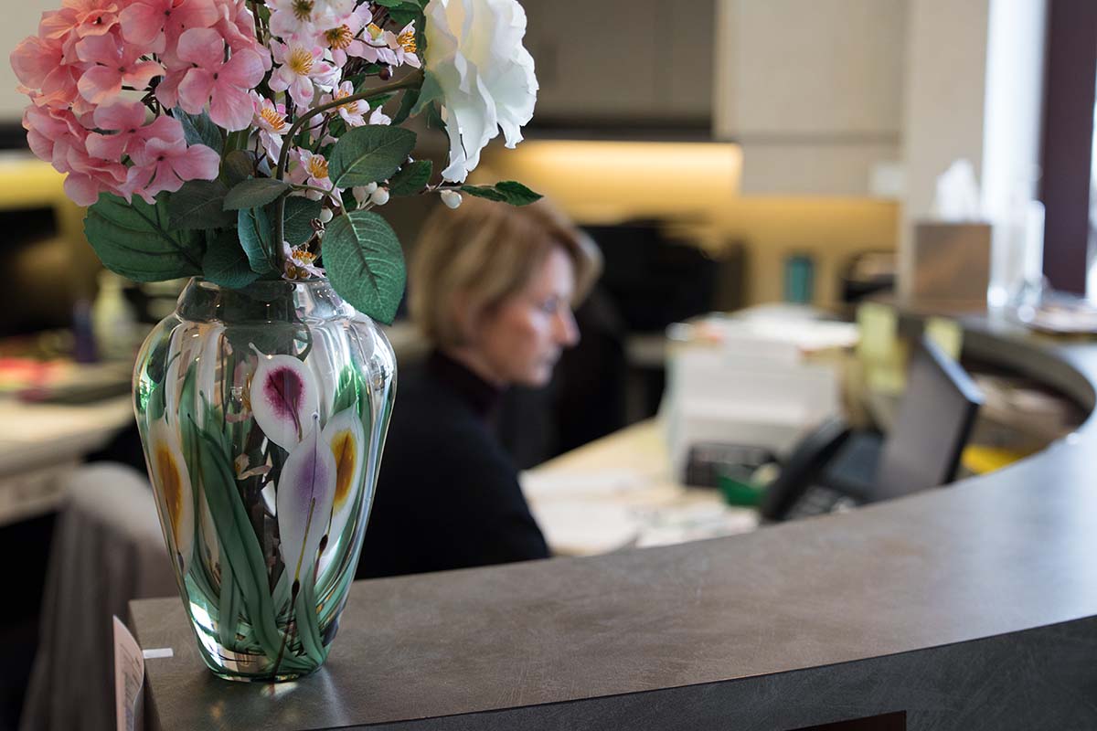 Vase of flowers on the front desk of Kelleher Orthodontics serving Dixon Jeanette at the front desk of Kelleher Orthodontics