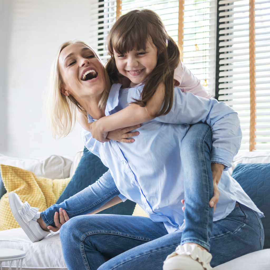 Senior woman happily examining her new clear Invisalign aligner trays.